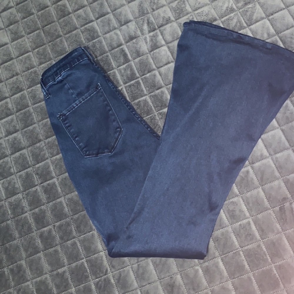 High waisted flare jeans with seam detail.